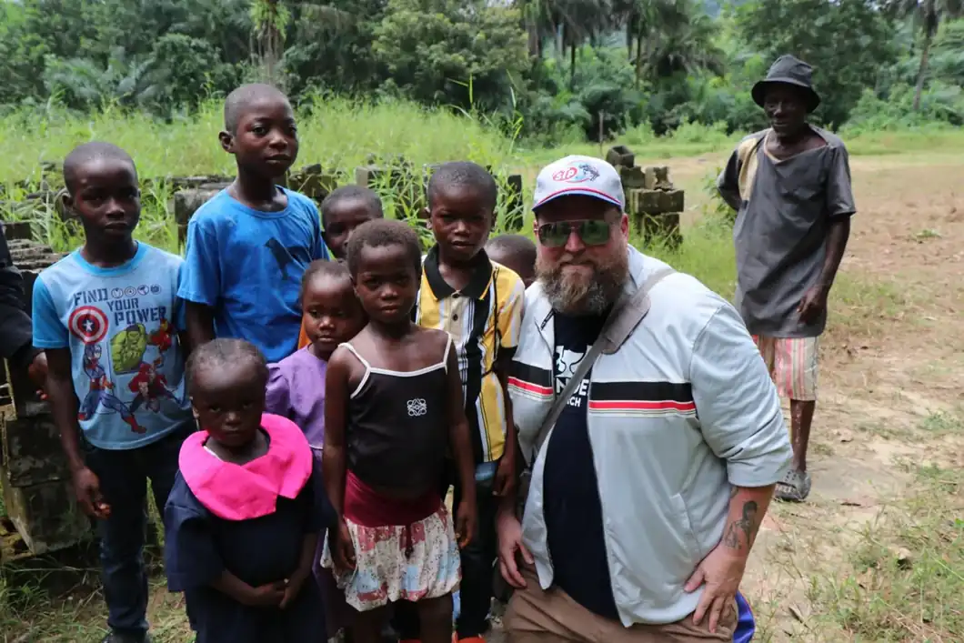 A visitor with children outside